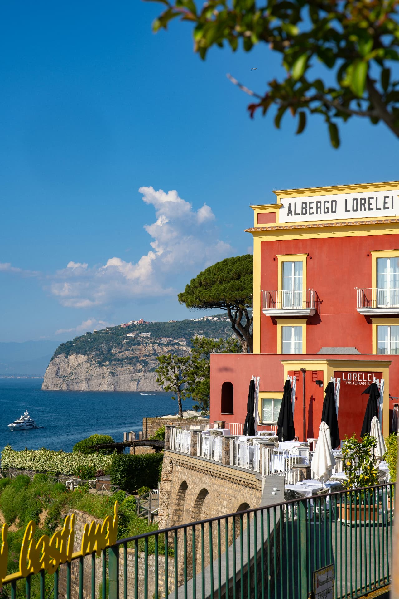 Albergo Lorelei on the Amalfi Coast with red cliffside terraces overlooking the sea