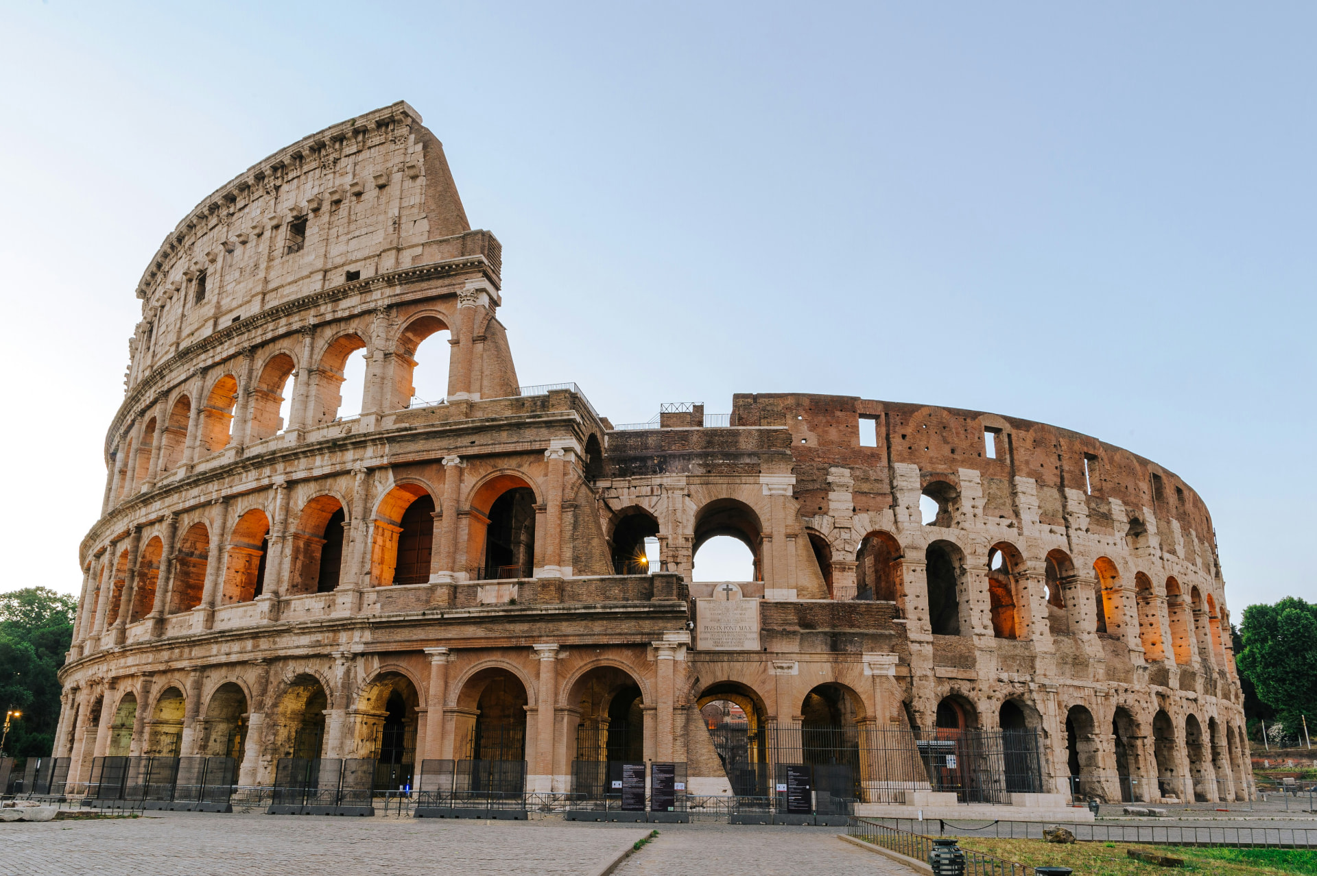 The ancient Colosseum in Rome glowing in warm early-morning light
